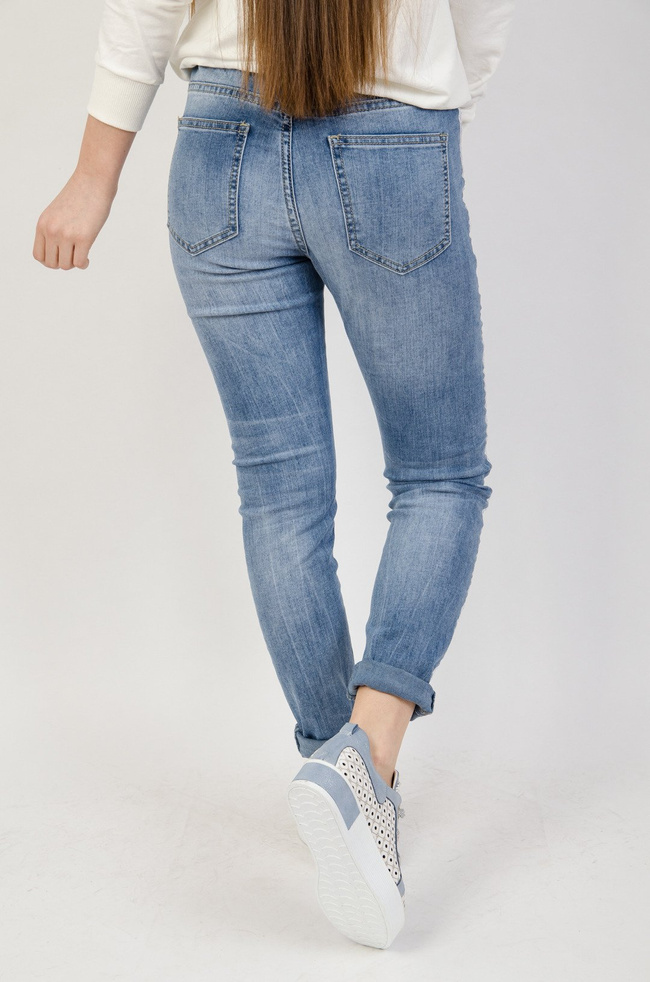 Jasne spodnie jeansowe z lampasem i gumką w pasie