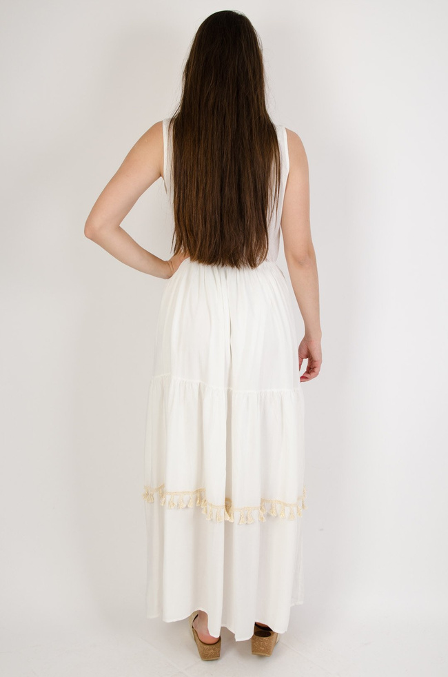 Długa sukienka ze złotymi cekinami obszyta pastelowymi frędzlami