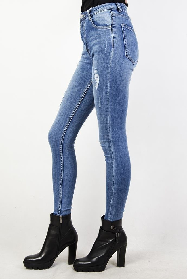 Jeansowe spodnie skinny jeans z przetarciami oraz wysokim stanem