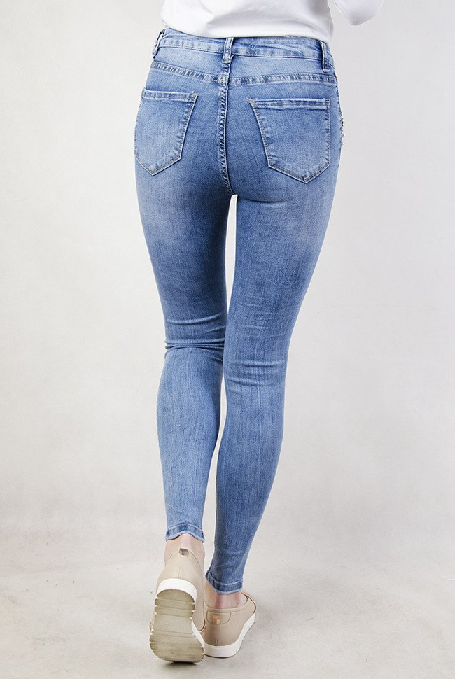 Jasne spodnie z koralikami przy kieszeni