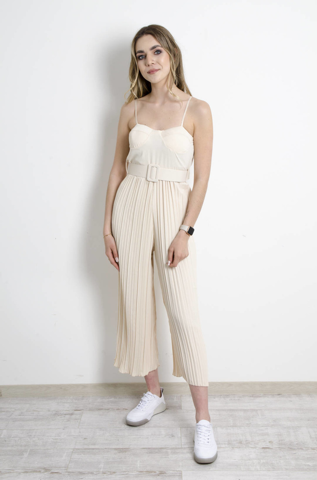 KOMBINEZON GORSETOWY Z PLISOWANYMI NOGAWKAMI BEŻOWY