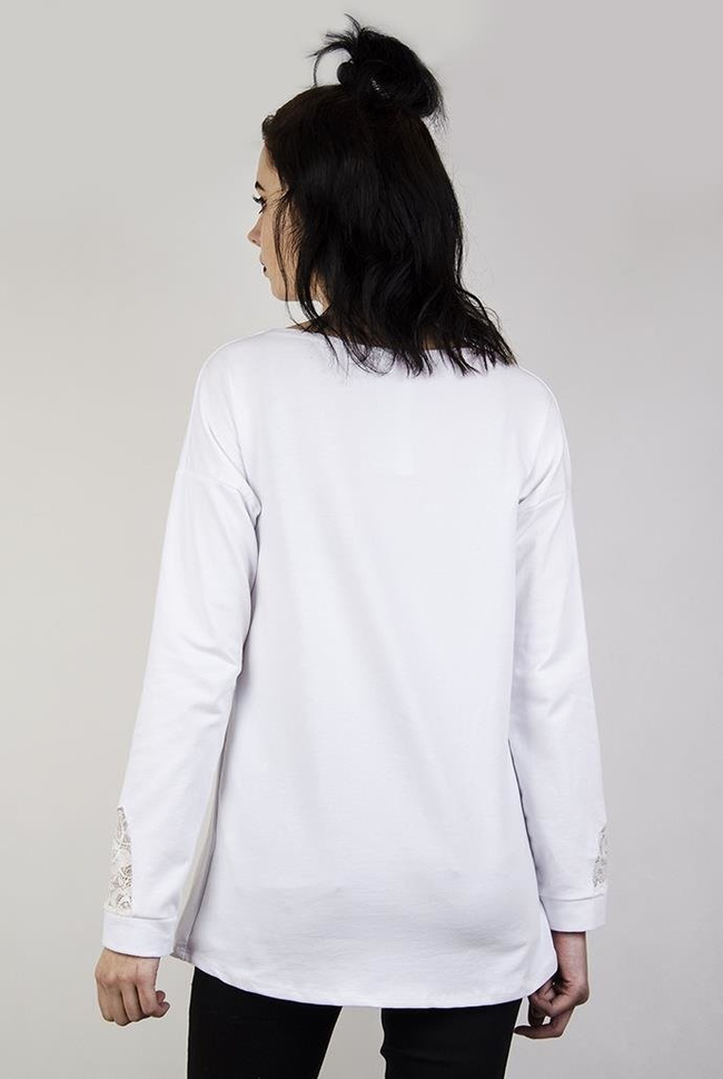 Biała bluzka z kokardką przy kieszonce