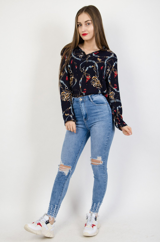 Jasne spodnie jeansowe z dziurami