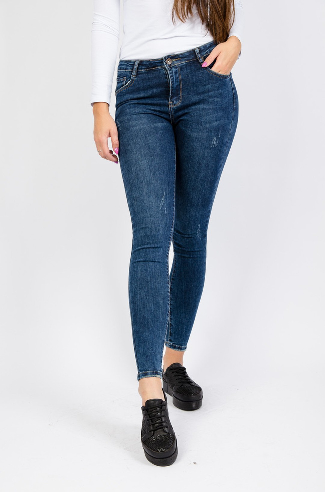 Ciemne spodnie jeansowe z przetarciami