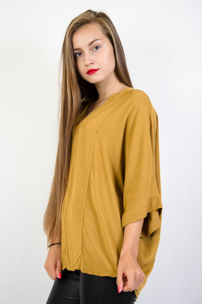 Żółta bluzka nietoperz z przedłużanym tyłem