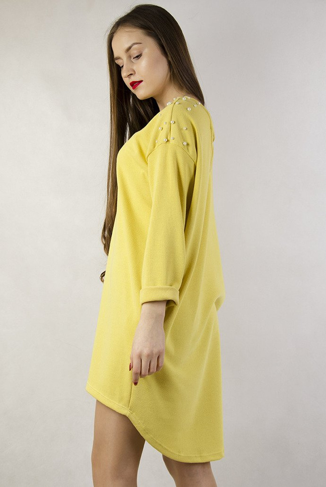 Żółta asymetryczna tunika z perełkami oraz wycięciem na plecach