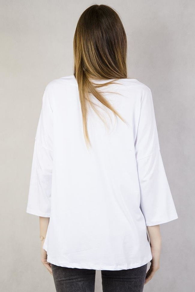 Biała bluzka z błyszczącą kieszonką