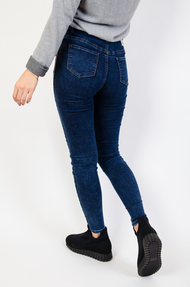 Granatowe spodnie jeansowe z lampasami
