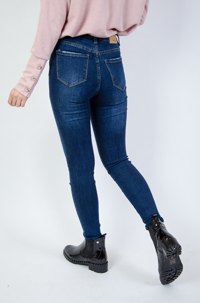 Jeansowe przylegające spodnie z przetarciami